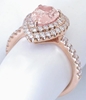 Pear Cut Padparadscha Sapphire and Diamond Halo Ring in 18k rose gold