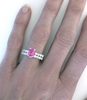 Oval Pink Sapphire Diamond Engagement Ring Set on the hand