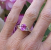 Natural Unheated Oval Pink Sapphire and Trillion White Sapphire Engagement Ring in 14k yellow gold for sale