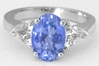 Oval Blue Sapphire and Trillion White Sapphire Three Stone Ring in 14k white gold