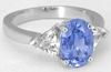 Natural Oval Blue Sapphire and Trillion White Sapphire Three Stone Ring in 14k white gold