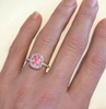 Genuine Peachy Pink Sapphire Ring with Diamond Halo in 14k white gold on the hand