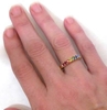 Princess Cut Rainbow Sapphire Rings in 14k yellow gold on the hand