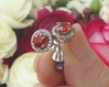 Natural Red Orange Sapphire Stud Earrings with a real diamond halo set in solid 14k white gold