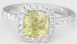 2 carat Cushion Cut Natural Yellow Sapphire Ring set in a diamond halo in 14k white gold