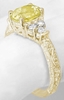 Ornate oval yellow sapphire ring in yellow gold