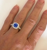 Ornate Blue Sapphire and Diamond Halo Ring on the hand