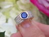 Natural Blue Sapphire Engagement Ring for sale with a Bezel Set Natural Blue Sapphire and Pave Set Diamonds in 18k gold