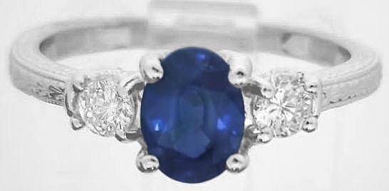 Natural Oval Blue Sapphire and Round White Sapphire Engagement Ring in 14k white gold