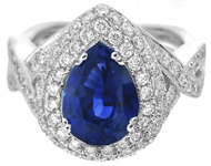 Large Pear Cut Natural Blue Sapphire Cocktail Ring with a real diamond halo in white gold setting for sale