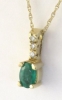 Natural oval emerald solitaire pendant and fine gold necklace in 14k yellow gold