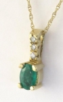 Natural oval emerald solitaire pendant and fine gold necklace in 14k yellow gold