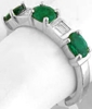 Three Stone Oval Emerald and Baguette Diamond Ring in white gold