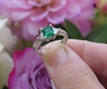 Natural Colombian Emerald Engagement Ring with Trillion Diamonds in 14k White Gold for sale. Classic Past Present Future Wedding Ring.