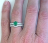 Natural Round Emerald Engagement Ring and Band on the hand