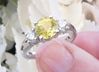 Natural Yellow Sapphire Engagement Ring with a round center yellow sapphire and real round side diamonds all in a solid 14k white gold band