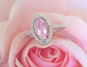 Marquise Natural Light Pink Sapphire Ring with a Diamond Halo set in solid 14k white gold for sale