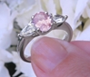 Oval Real Light Pink Sapphire Three Stone Ring with Natural White Sapphire side gemstones in sold 14k white gold