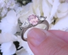 Three stone oval pink and pear white sapphire wedding ring set in white gold with real sapphires