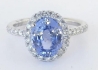 Rare unheated Ceylon sapphire ring surrounded by sparkling diamonds