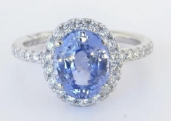 Rare unheated Ceylon sapphire ring surrounded by sparkling diamonds