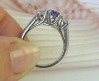 Classic 14k white gold band with purple sapphire centerpiece