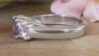 Round purple sapphire and white sapphire three stone design