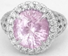 Natural Oval Light Pink Sapphire Ring with Diamond Halo in ornate white gold band for sale