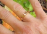 natural sapphire bar-set ring featuring peach orange and pink princess cuts