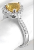 Side View of Heart Cut 7mm Orange Yellow Sapphire with Diamond Halo Design Setting in 18k white gold