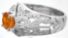 Side View of Floral Design Wide Band Vintage Styled Ring with Milgrain Edging Featuring Orange Sapphire