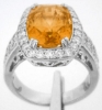 Bold Cushion Cut 6.95 carat Orange Sapphire and Diamond Halo Ring in 18k white gold