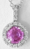 Round cut natural pink sapphire ring in 14k white gold