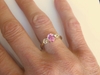 Natural Oval Pink Sapphire Three Stone Ring with white sapphires in 14k yellow gold
