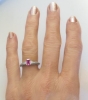 Natural Pink Sapphire in an Emerald Cut Setin in a Diamond Accented Simple Ring in 14k white gold