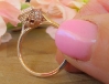 Rose gold engagement ring with radiant pink sapphire center