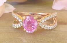 Oval pink sapphire ring in 14k rose gold with diamond split shank