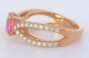 Bubblegum pink sapphire engagement ring accented with diamonds