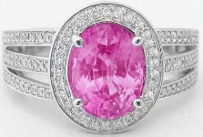 Oval cut natural pink sapphire ring in 14k white gold