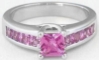 Princess Cut Natural Pink Sapphire Ring in 14k white gold with Channel Set Pink Sapphires in the band