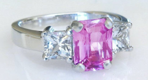 Radiant cut natural hot pink sapphire three stone engagement ring in platinum