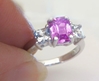Radiant cut natural hot pink and white sapphire three stone engagement ring in platinum