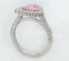 Natural trillion cut pink sapphire ring with a diamond halo in 14k white gold shown upright view