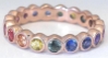 Bezel set natural rainbow sapphire eternity ring in gold