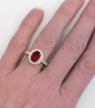 Genuine Oval Ruby in Diamond Halo Setting on the hand