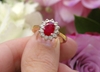 Genuine Oval Ruby Engagement Ring with Natural Diamond Halo set in a solid 14k yellow gold and white gold band