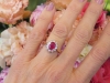 Oval Natural Ruby and Diamond Halo Ring in 14k white and yellow gold