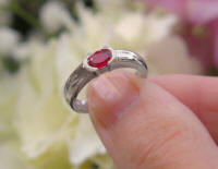 Natural East West Set Oval Ruby Solitaire Ring with Semi Bezel in solid 14k white gold