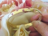 Unique heavy 14k yellow gold bangle bracelet with burnished natural round pink sapphires