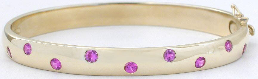 Heavy 14k yellow gold bangle bracelet with burnished real round pink sapphires for sale 